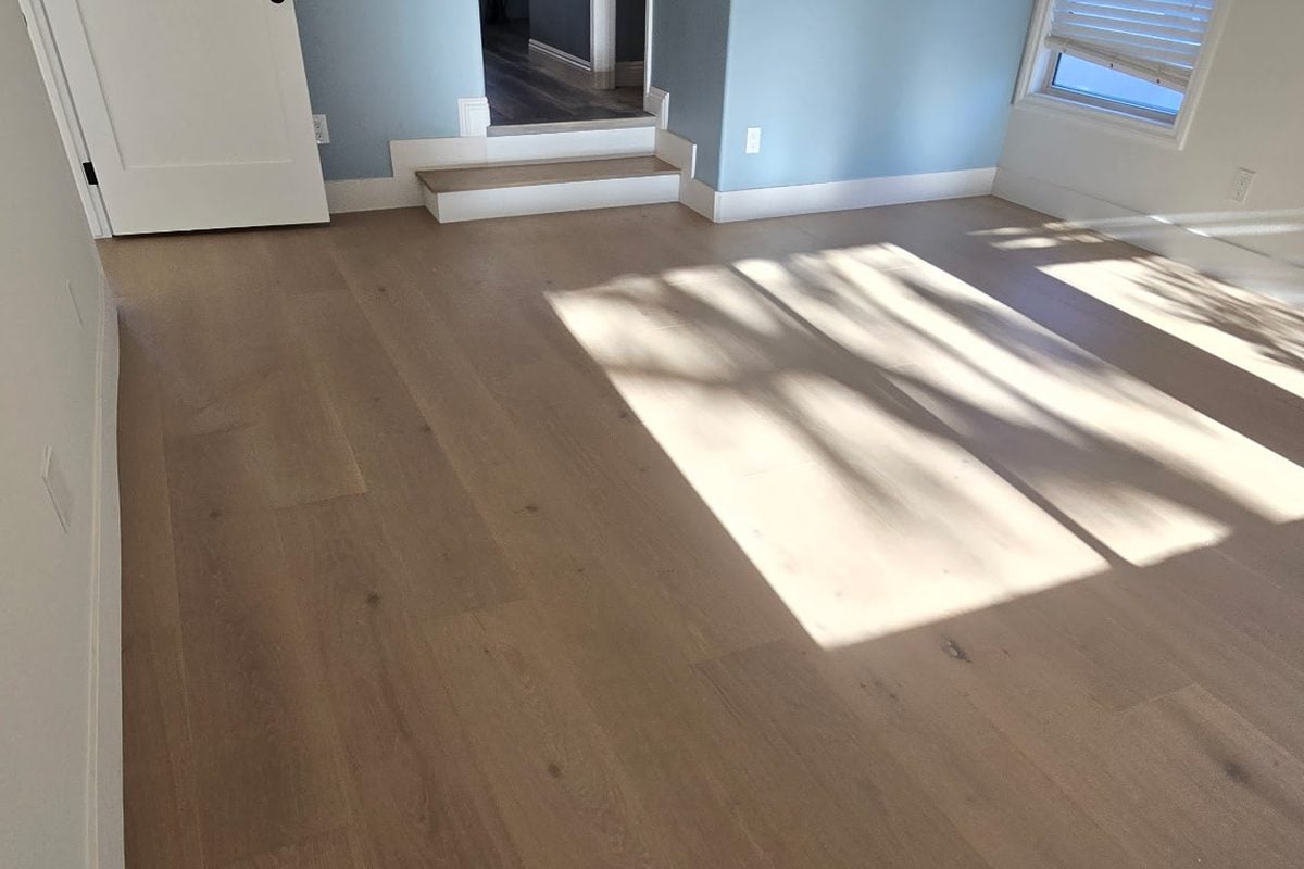 European oak hardwood flooring installed in a primary bedroom in Los Angeles