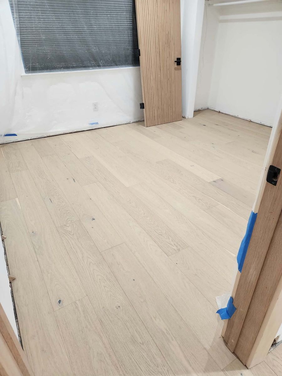 Light oak engineered hardwood floor in a Calabasas bedroom