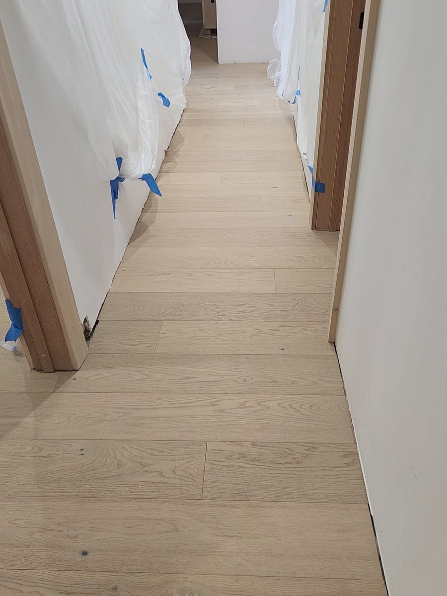 Oak hardwood flooring installed down a hallway in a Calabasas home