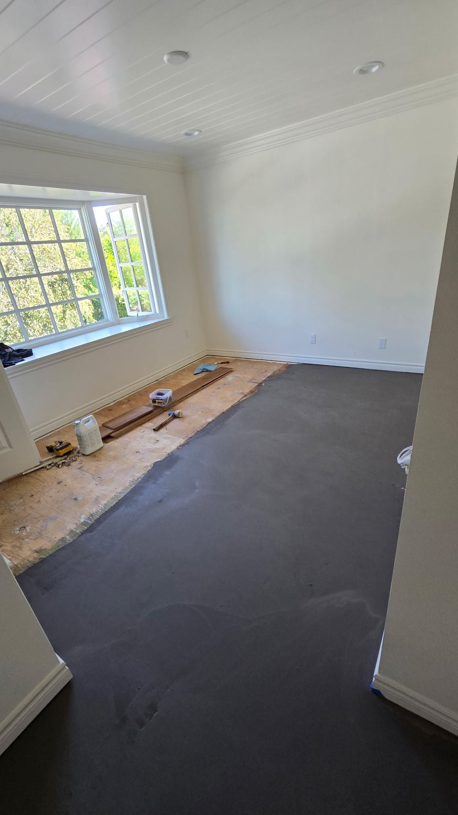 Cured self-leveling underlayment ready for engineered hardwood installation