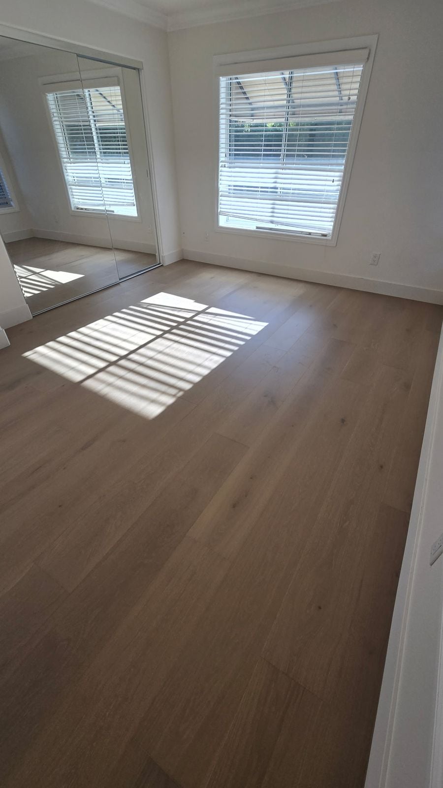 Urban Floor Brindisi European oak hardwood flooring in a sunlit Los Angeles bedroom