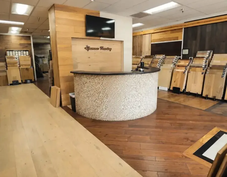 Glamour Flooring showroom on Victory Blvd with full-size hardwood sample boards on display