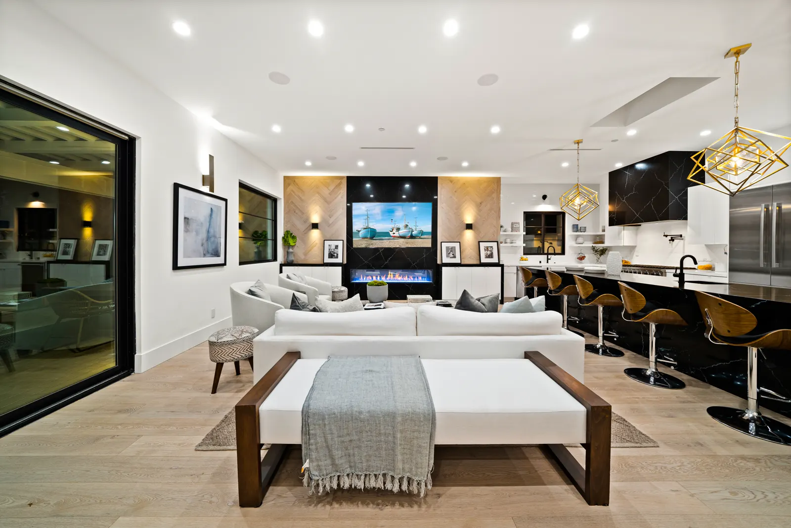 Open great room with light hardwood and modern fireplace wall, Los Angeles, Glamour Flooring project