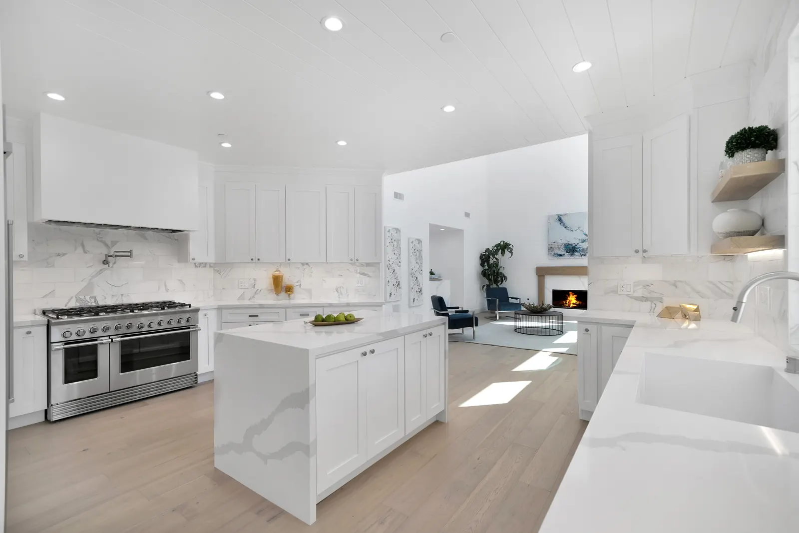 White kitchen with marble island and light hardwood, Granada Hills, Glamour Flooring project