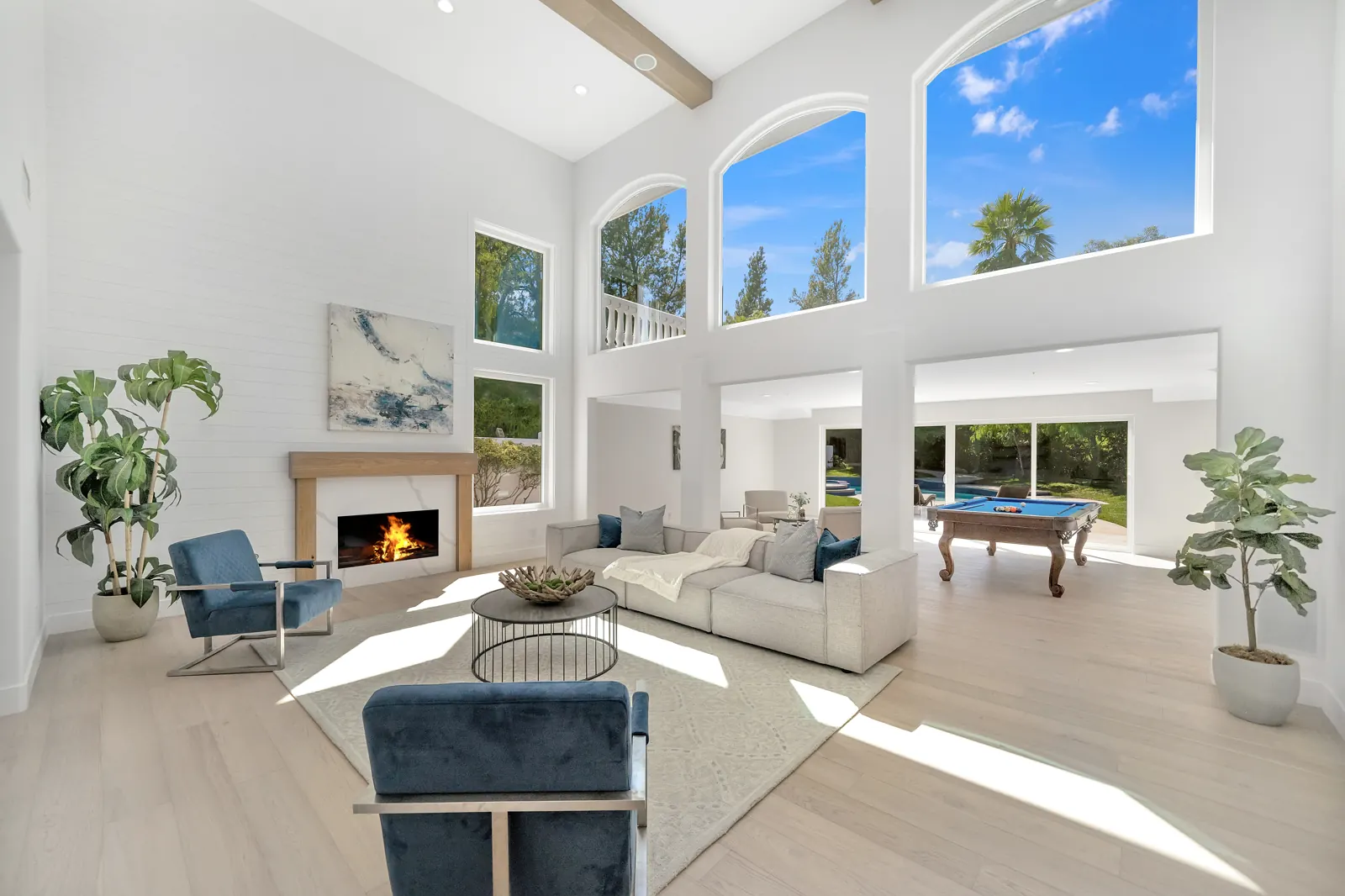 Family room with fireplace and light hardwood, Granada Hills, Glamour Flooring project
