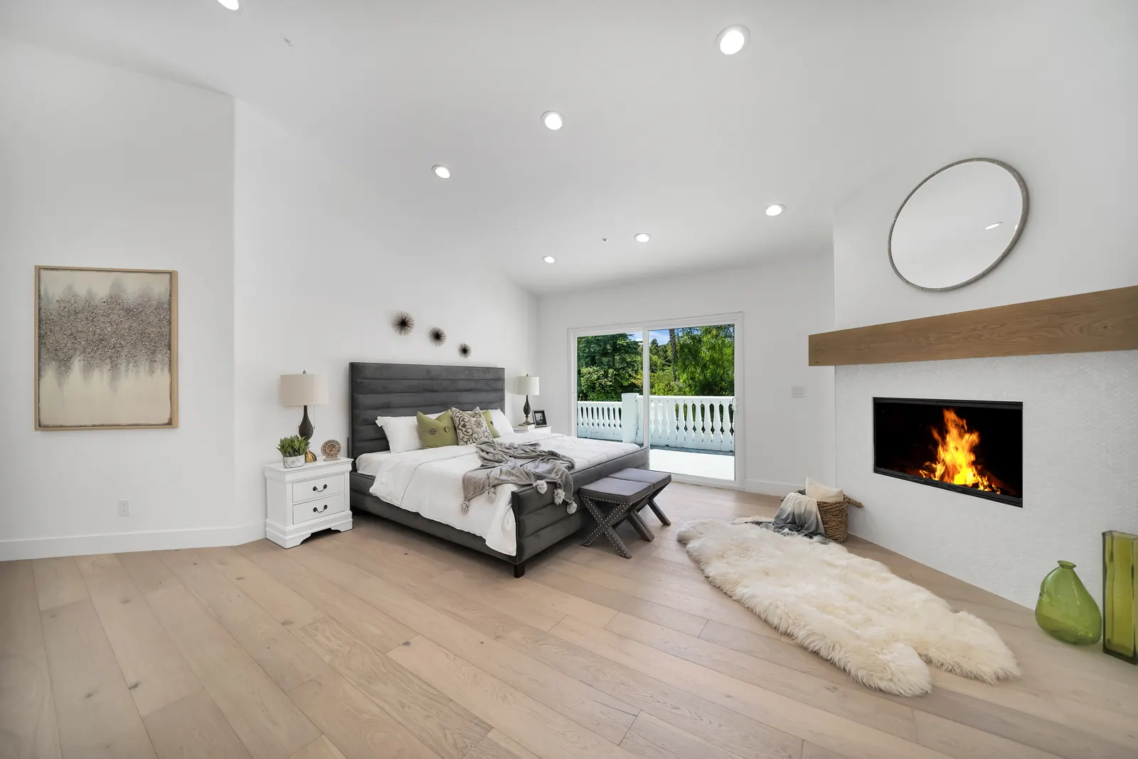 Primary bedroom with fireplace and light hardwood, Granada Hills, Glamour Flooring project