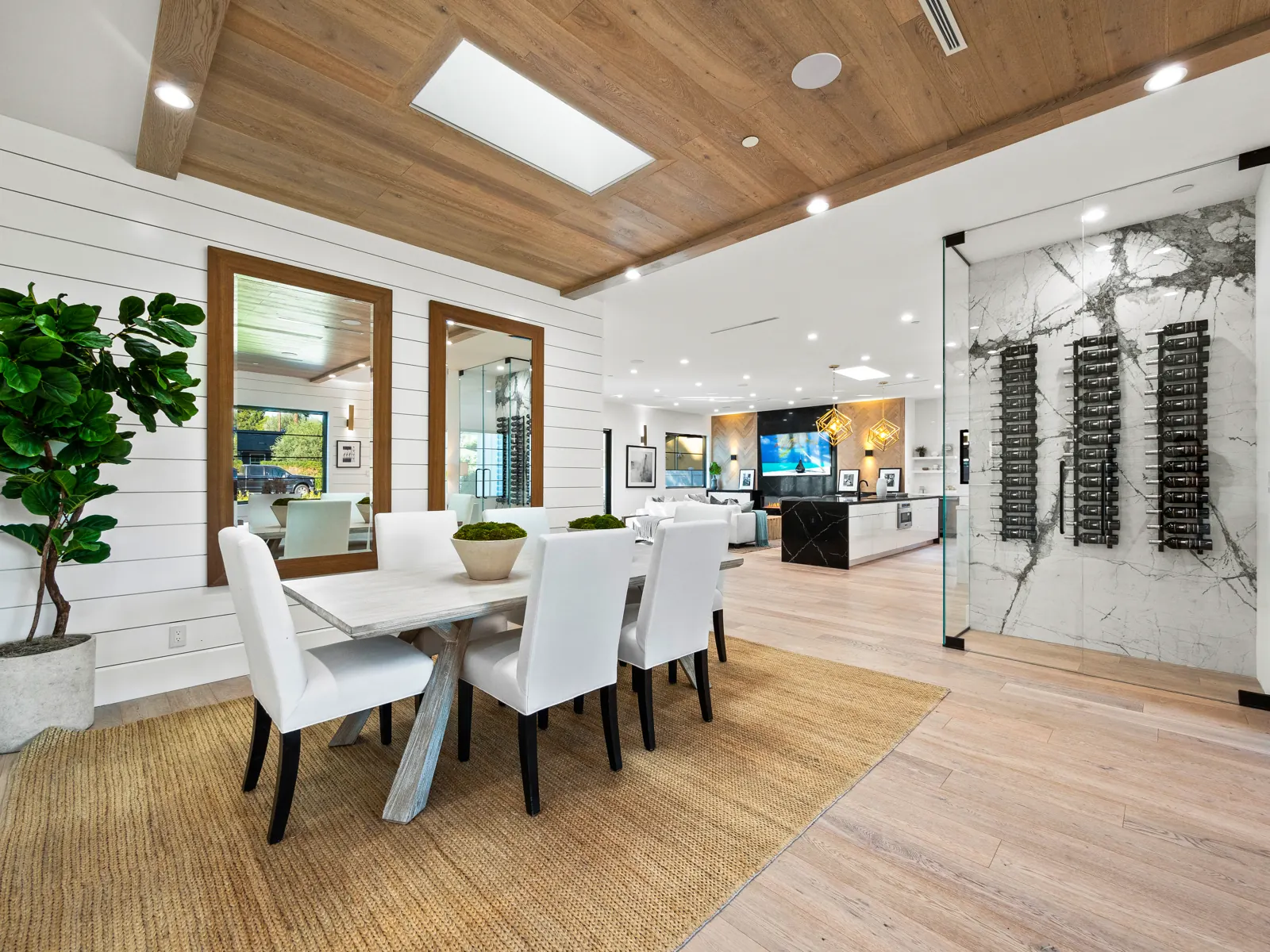 Dining area under a wood ceiling with light hardwood, Los Angeles, Glamour Flooring project