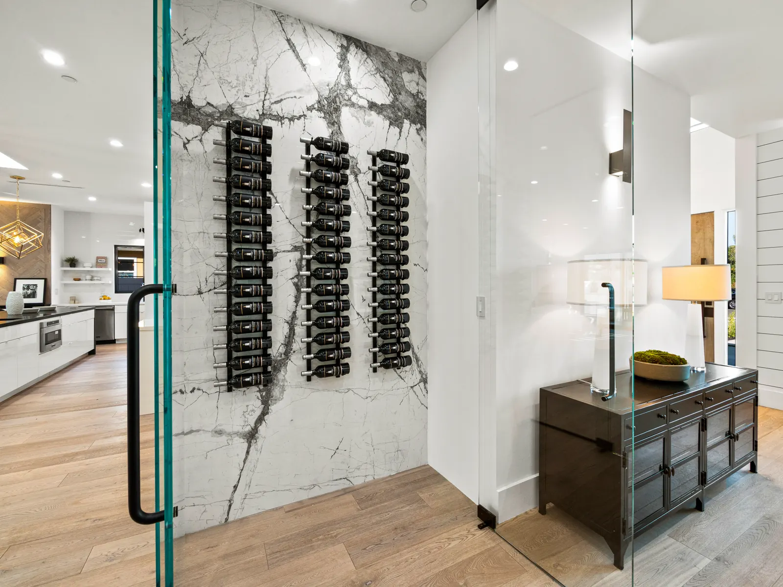 Entry with glass wine wall and light hardwood, Los Angeles, Glamour Flooring project
