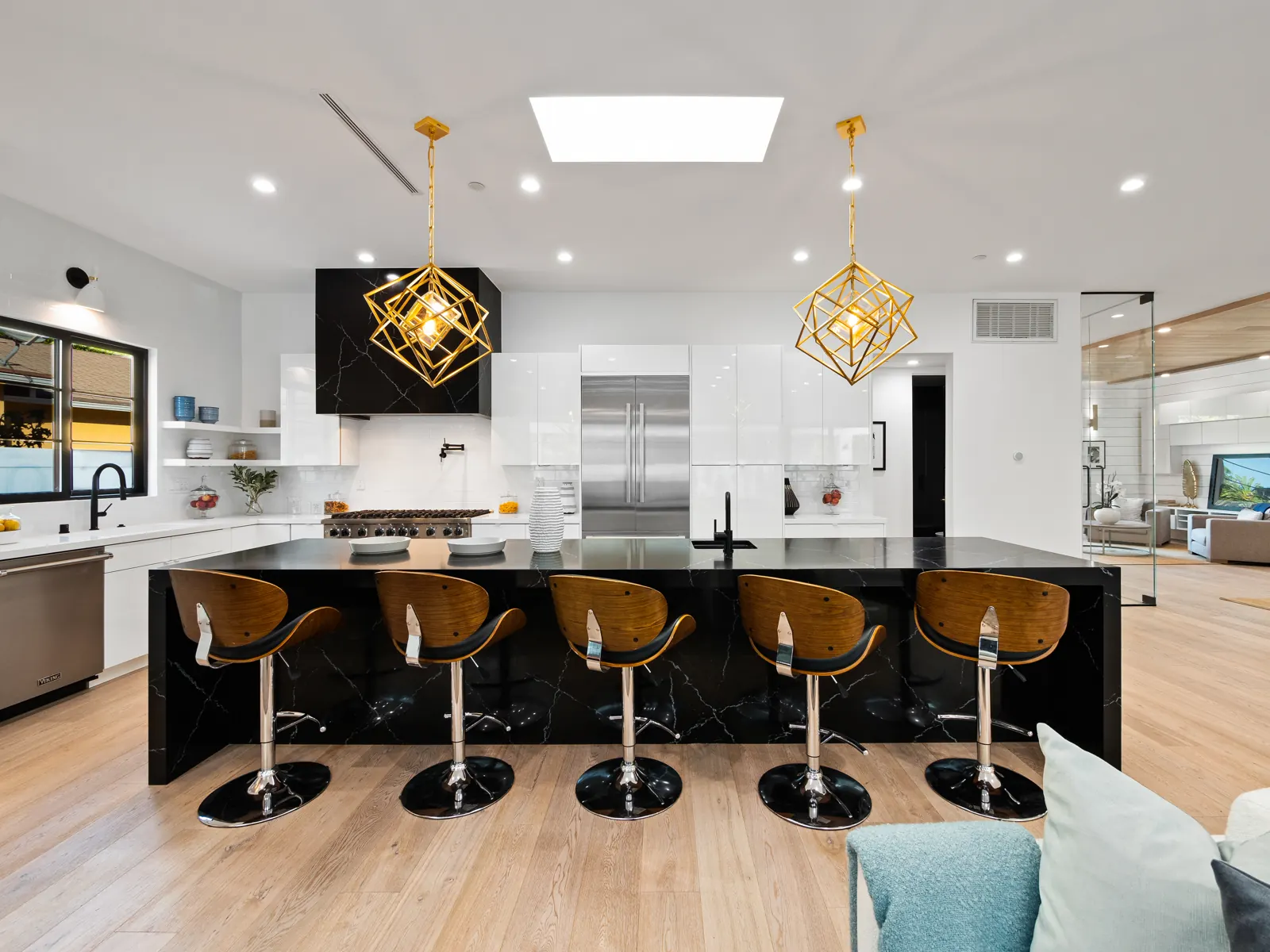 Kitchen bar seating at a black island, Los Angeles, Glamour Flooring project
