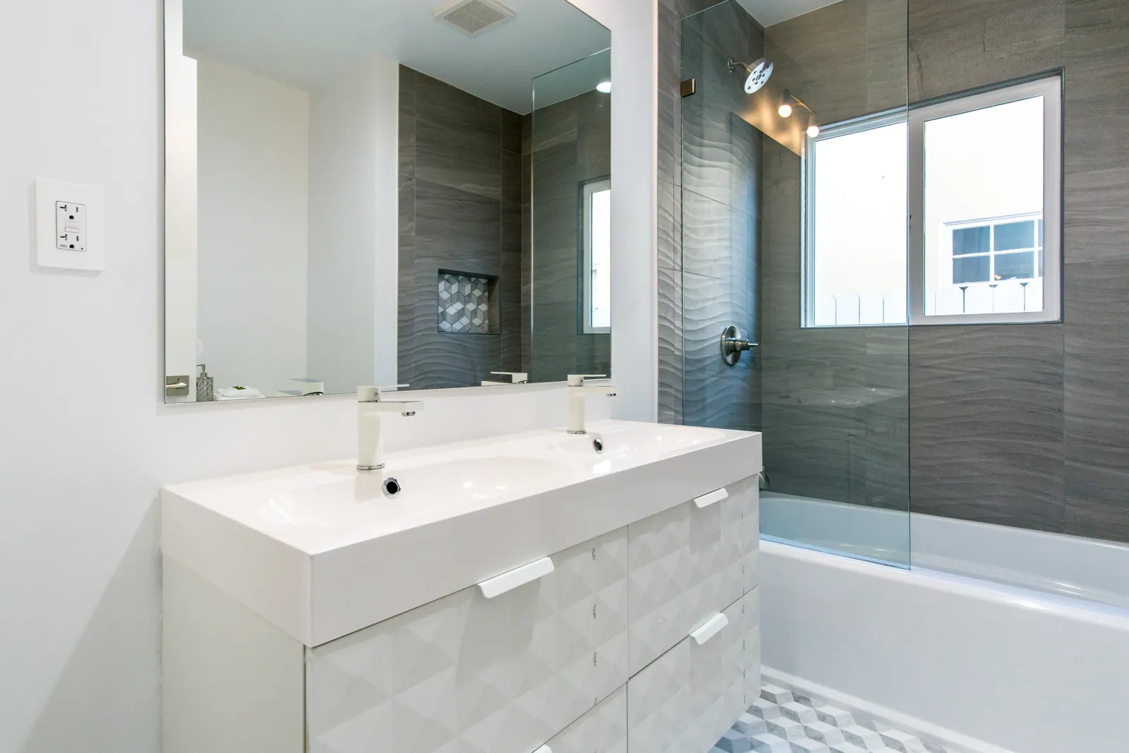 Bathroom with white vanity and dark tile shower, Sherman Oaks, Glamour Flooring project
