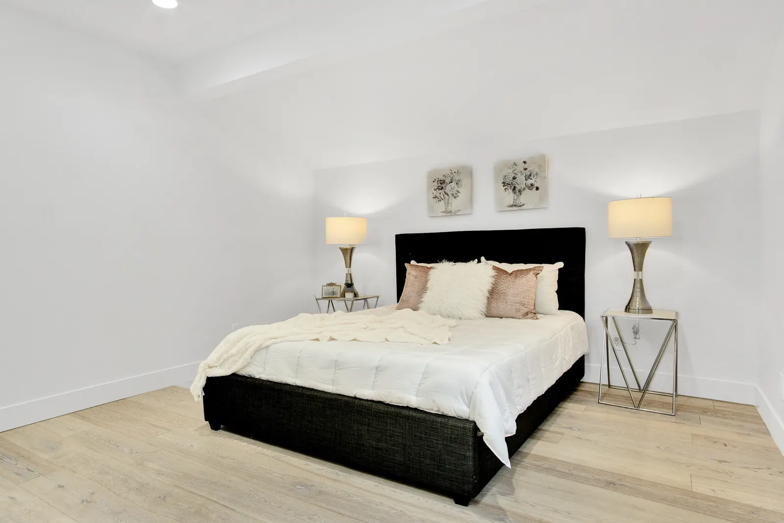 Bedroom with light flooring and black headboard, Sherman Oaks, Glamour Flooring project