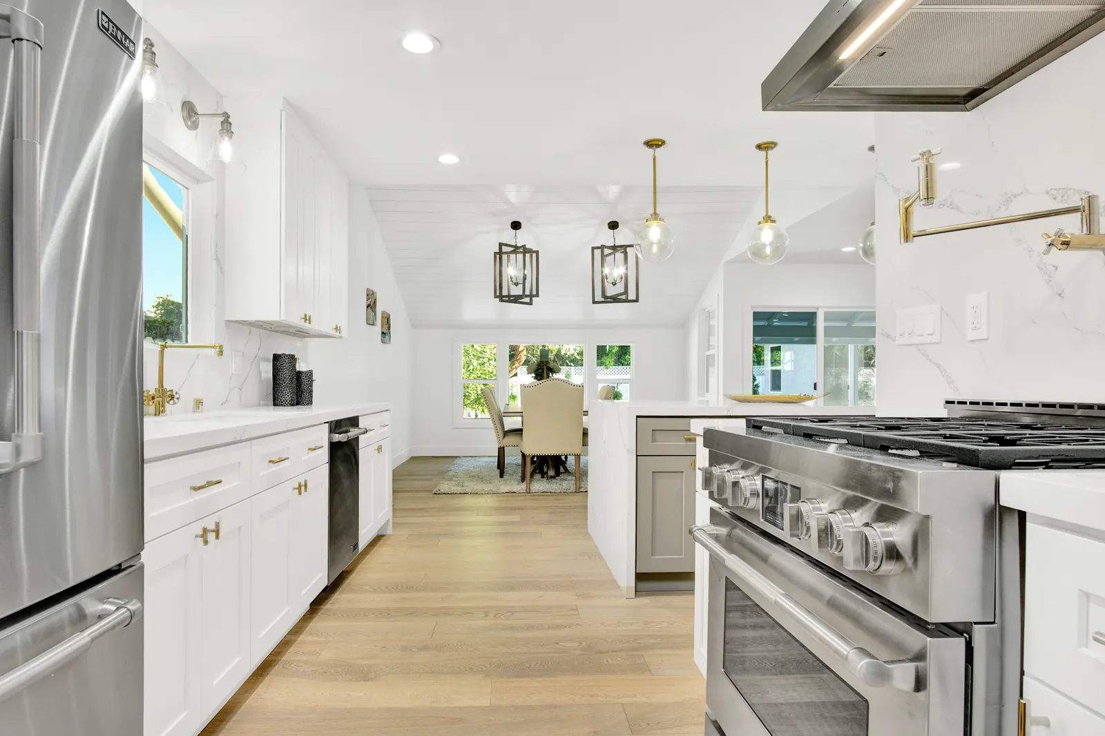 Kitchen with white cabinets and stainless range, Sherman Oaks, Glamour Flooring project