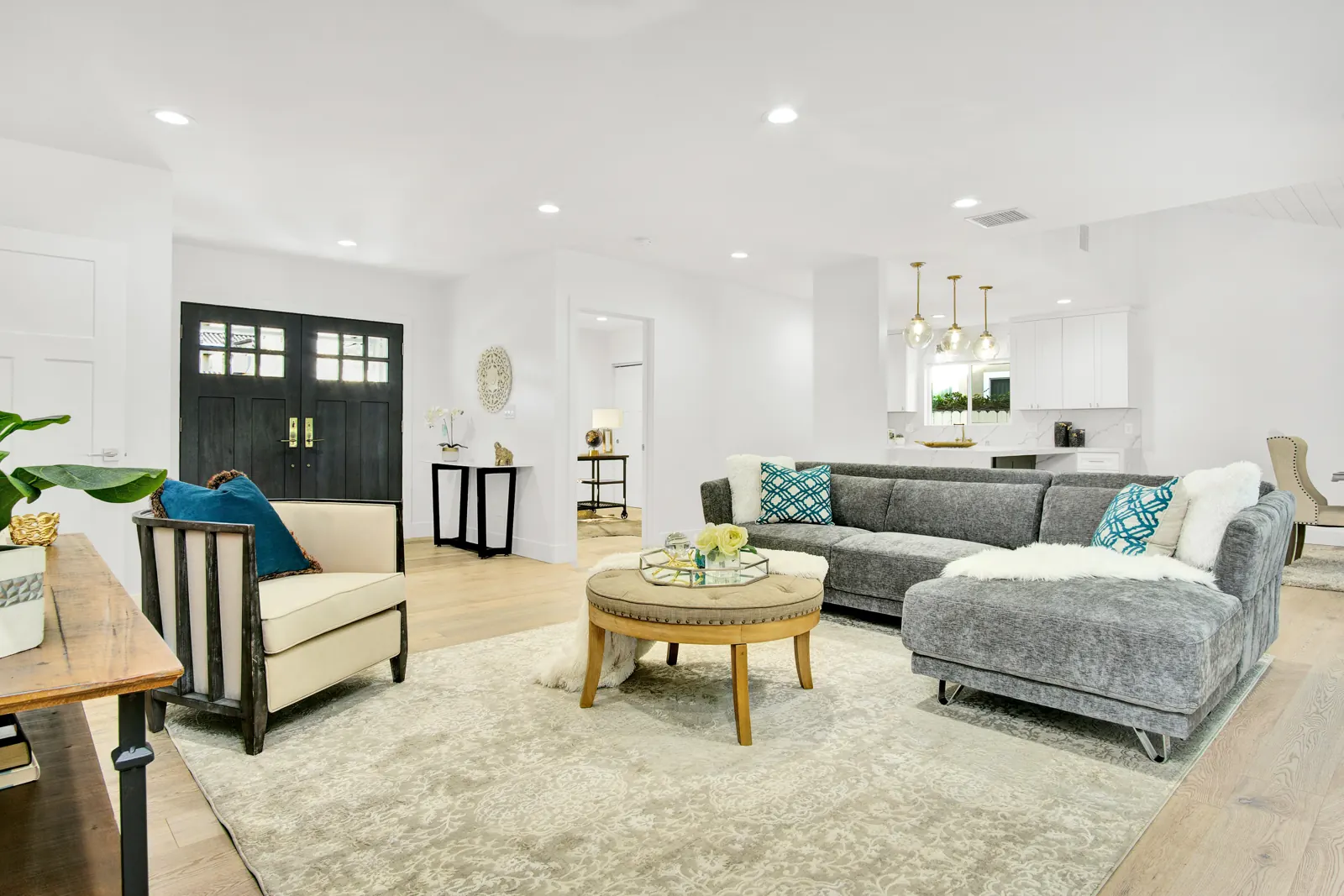 Living room with sectional and light flooring, Sherman Oaks, Glamour Flooring project